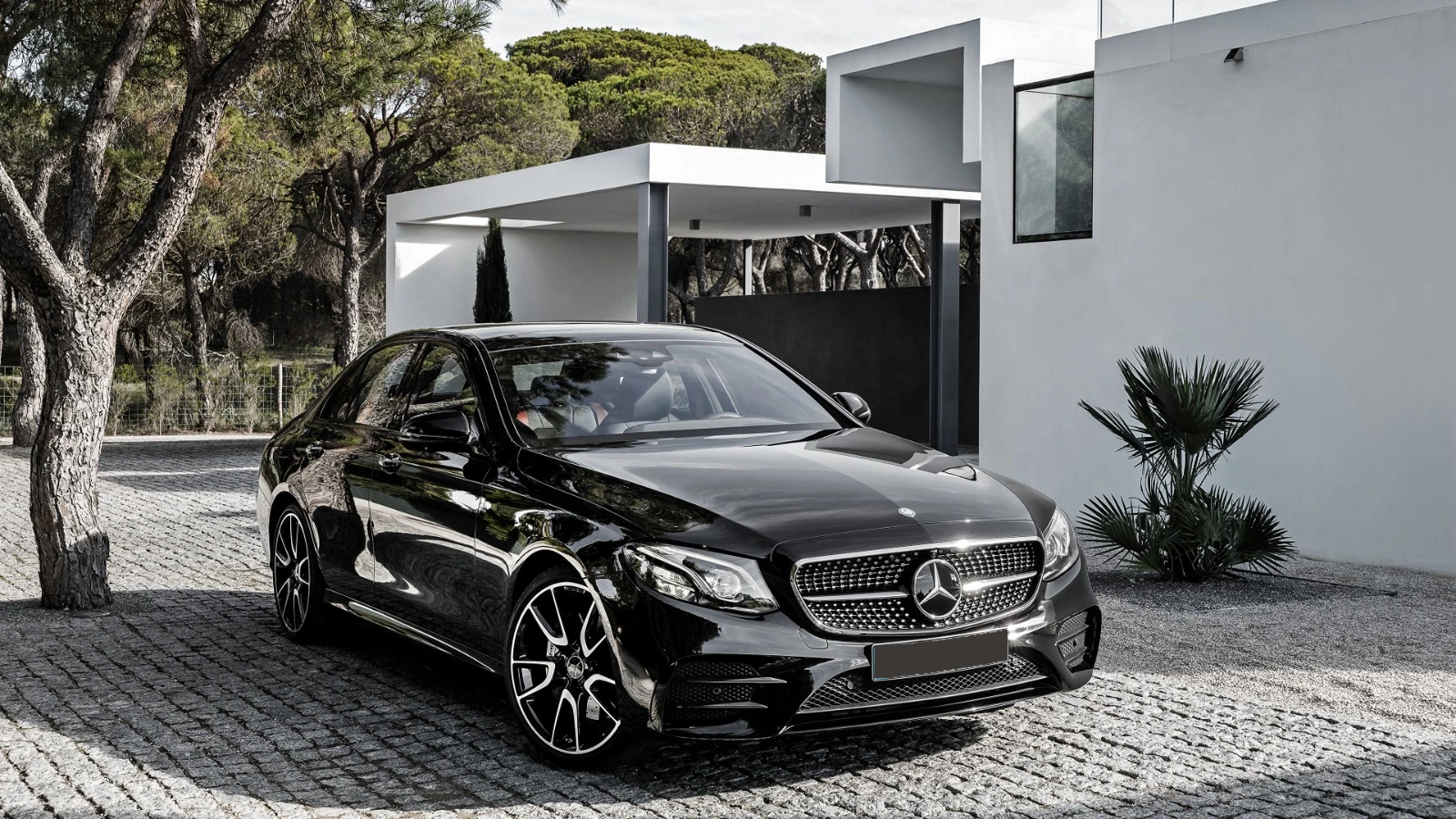 Diamond executive car outside a modern property